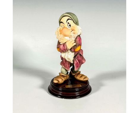 Produced in an open limited edition, featuring Grumpy from Snow White and the Seven Dwarfs in matte finish on a wooden base w