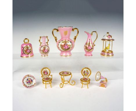 Nice grouping including a small vase, pitcher, bell, gramophone, china plate, a mini vase, a bird in cage, and a table with t