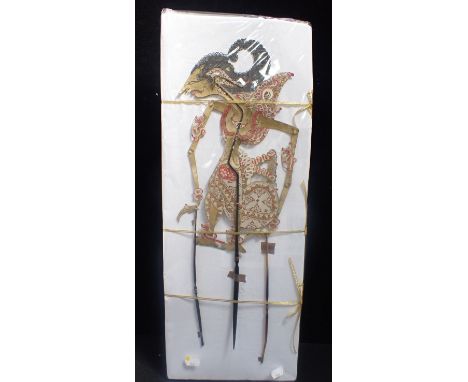 A BALINESE SHADOW PUPPET, PAINTED on horn handles 48cm, possibly 19th century