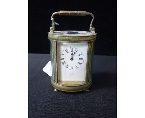 AN ASPREY RETAILED OVAL BRASS CASED CARRIAGE CLOCK the dial marked Asprey of Bond Street, London (needs attention)