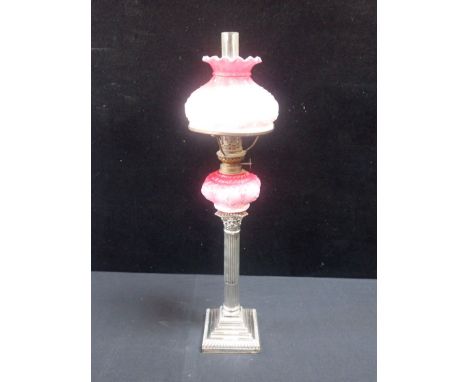 A VICTORIAN OIL LAMP, ON A SILVER CORINTHIAN COLUMN BASE (an adapted candlestick) approx 57cm high