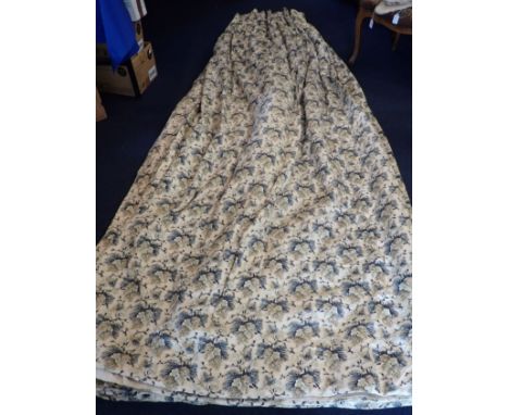 A LARGE PAIR OF COUNTRY HOUSE CURTAINS with oak leaf pattern, lined, interlined, buckram headings and with tie backs. Each cu