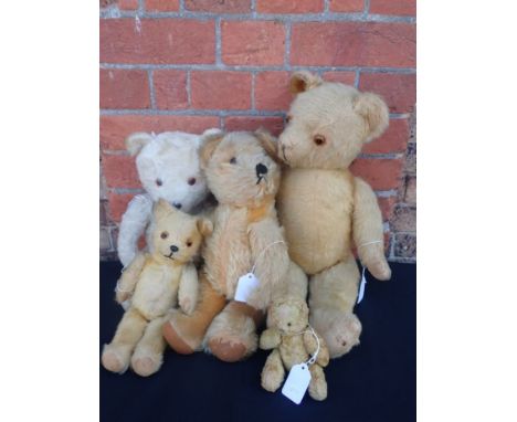FIVE VINTAGE TEDDY BEARS, THE PALE ONE WITH MUSICAL MOVEMENT playing Brahms' lullaby (reluctantly) when wound and squeezed (A