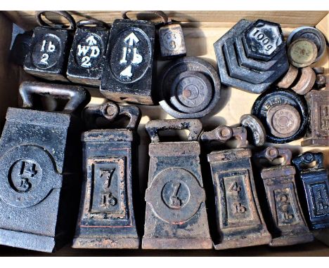 A COLLECTION OF CAST-IRON WEIGHTS some handled, for scales, the largest 14Lb.