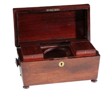 A REGENCY ROSEWOOD TEA CADDY of sarcophagus shape with domed top, fitted two canisters, on bun feet, 20cm high (lacking mixin