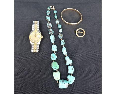 A TURQUOISE NECKLACE with a yellow metal bangle and brooch and a replica Rolex watch