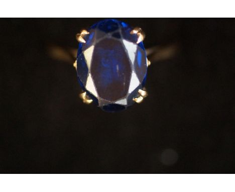 9ct Gold ring set with large blue stone 