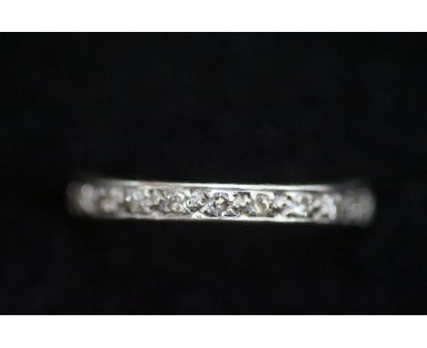 White metal possibly platinum Diamond eternity ring Size M (1 diamond missing)