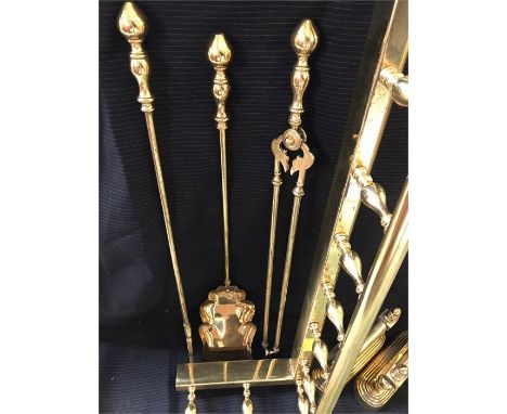 A Fireside set to include Brass fender, fire dogs and fire tools