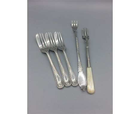 Hallmarked silver to include three cake forks, a pickle fork and a pickle fork with a mother of pearl handle.