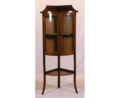 rounded top above two rounded glazed and inlaid cupboard doors, above lower shelf, on splayed legs