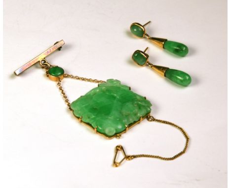 the square jade stone engraved with foliage suspended from at a circular jade stone and a later 9ct gold pin; and A Pair of G