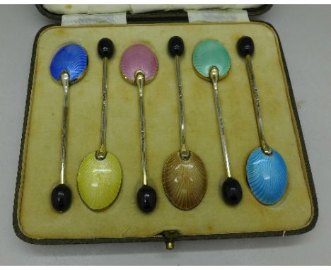 Six silver and enamel coffee bean spoons, cased, Birmingham 1939