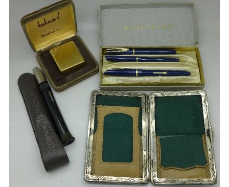 A Waterman's pen with 14ct gold nib, a Colibri lighter, an optical instrument and a purse