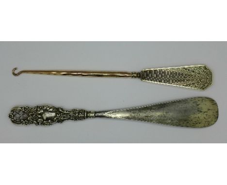 A silver handled Art Deco button hook and a shoe horn