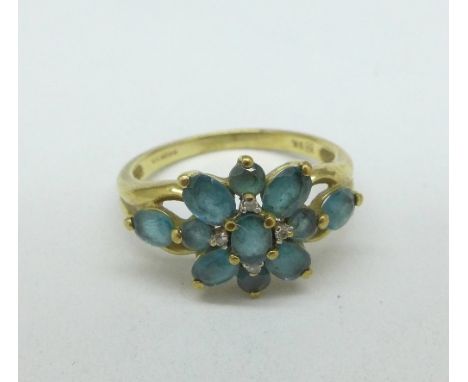 A 9ct gold, blue topaz and diamond ring, 2.6g, M