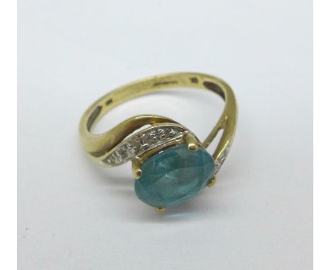 A 9ct gold, blue topaz and diamond ring, 2.6g, Q