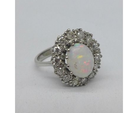 A vintage 18ct white gold, opal and diamond cluster ring, c.1960's, 0.5carat diamond weight, L, 4.42g