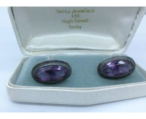 A pair of sterling silver and amethyst cufflinks, boxed