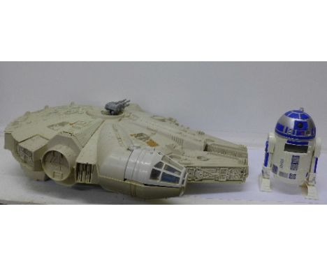 A Star Wars Millennium Falcon, missing ramps, and an R2D2 alarm clock