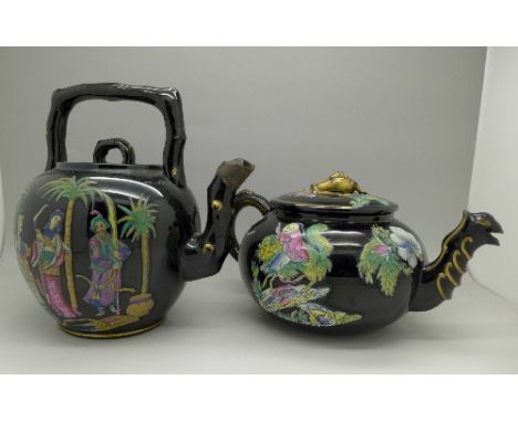 Two Victorian black glazed teapots, enamel decorated with Persian and oriental figures, Persian spout a/f