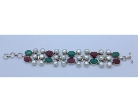 A silver, pearl and gem set bracelet