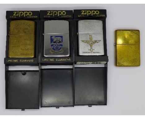 Four Zippo lighters including a Vietnam 71-72 commemorative lighter and an early Zippo lighter, (4)