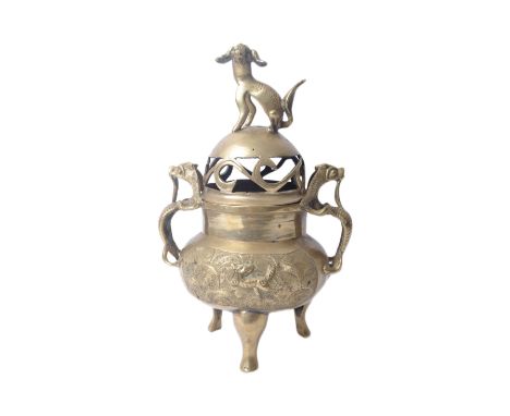An early 20th century Chinese brass censer / incense burner, with Dog of Fo finial mounted on lid, which features cut out flo