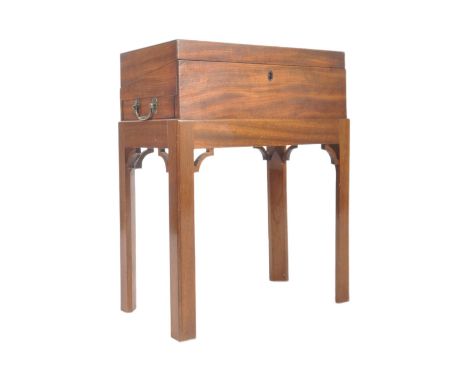 A George III 19th century mahogany writing box on stand. The box having twin shaped handles to the sides with hinged top open