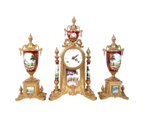 A three piece modern reproduction clock and garnituresuite. Inset movement by Franz Hemle set behind a white enamel dial with