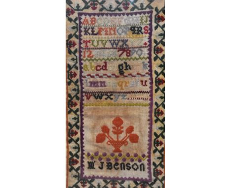 19th Century School, a Victorian embroidered alphabet sampler, unframed and within two sheets of perspex, measuring 19cm x 39