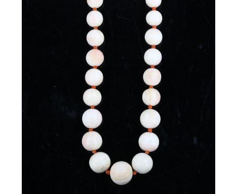 A Victorian graduated bleached pearl bead necklace, with coral bead spacers and unmarked gold clasp, bead sizes 13.8 - 4.9mm,