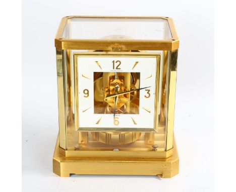 JAEGER LECOULTRE - a gilt-brass Atmos clock, square white lacquered dial with quarterly Arabic numerals and glass panelled ca