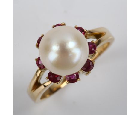 A late 20th century 14ct gold pearl and ruby cluster ring, set with whole pearl and round-cut rubies, pearl diameter 9.1mm, s