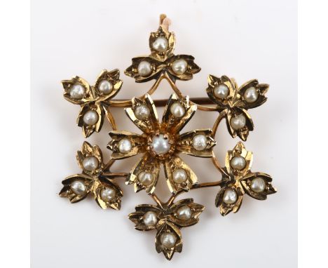 An Edwardian 9ct gold pearl floral pendant/brooch, diameter 30.6mm, 3.1gNo damage or repairs, all stones present, pendant loo