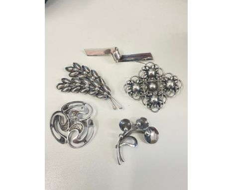 Various Danish silver brooches, makers include Hermann Siersbol, largest length 63.9mm, 39.4g total (5) No damage or repairs,