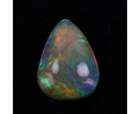 An unmounted pear cabochon black opal, 12.68mm x 9.78mm x 4.35mm, 0.47gNo chips cracks or damage, opal has a vivid play of co