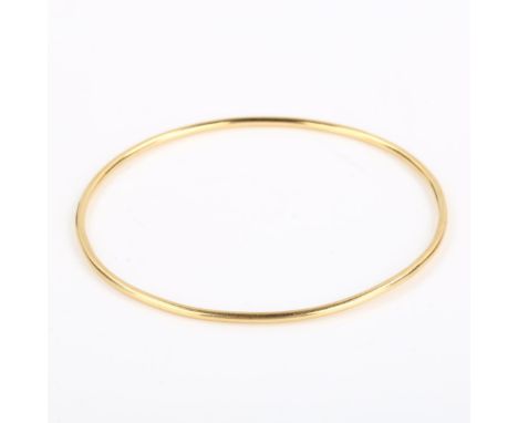 A Turkish 14ct gold slave bangle, band width 1.8mm, internal diameter 6cm, 7.4gNo damage or repairs, a few very minor dents, 
