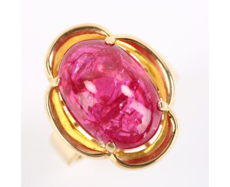 A late 20th century 14ct gold synthetic ruby dress ring, set with oval cabochon ruby, ruby measures: 15.81mm x 11.08mm x 7.08