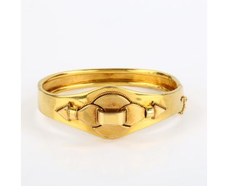 CHARITY LOT (SOLD ON BEHALF OF ST MICHAEL'S HOSPICE) - a Victorian 18ct gold Etruscan style hinged bangle, with applied bead 