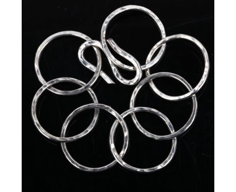 A Vintage unmarked silver hoop bracelet, planished decoration, bracelet length 20cm, 41.7gNo damage or repairs, only light su