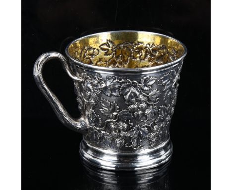 A Victorian silver grapevine mug, relief embossed and chased decoration with vine handle and gilt interior, by John Samuel Hu