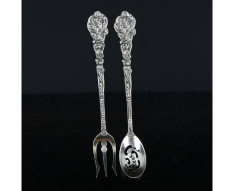 GORHAM - an American sterling silver matching sifter spoon and bread fork, cast cherub decoration, length 15.5cm, 1.6oz total