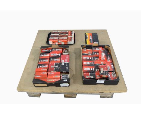Vintage and modern car parts, spark plugs by Motorcraft Ford and Champion.
