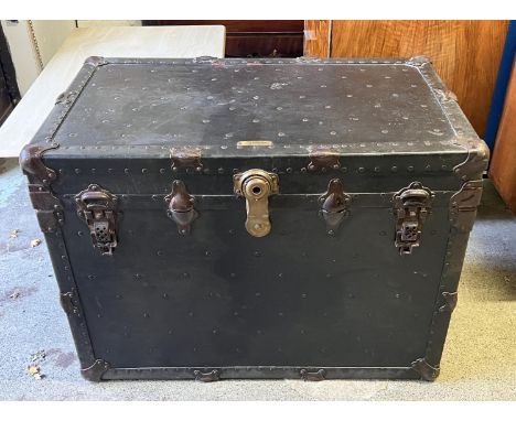TRUNK, early 20th century studded and iron bound, manufactured by WF Faist Seattle, Washington, 66cm H x 91cm x 55cm. 