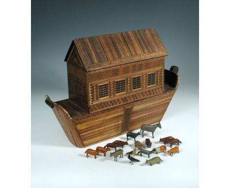 An early 19th century strawwork model ark, with removable upper section and twenty small painted wood animals 36 x 55cm (14 x