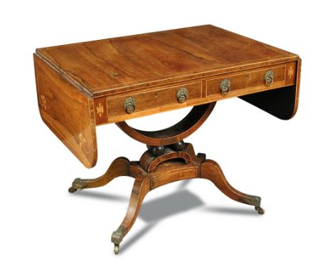 A Regency rosewood sofa table, with boxwood line inlaid decoration and corner anthemions, fitted two frieze drawers, brass ri