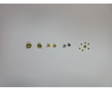 A collection of loose fancy yellow round brilliant cut diamonds, of varying shades and saturations of yellow, to include a li