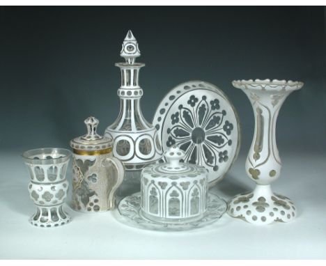 A collection of Bohemian white overlay glass, to include a tankard and cover, a butter dish and cover, a large comport with d