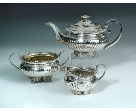 A George IV silver three piece teaset, by Joseph Angell II, London 1820, comprising:- a teapot of compressed circular form, p